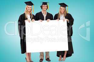 Composite image of college graduates showing card