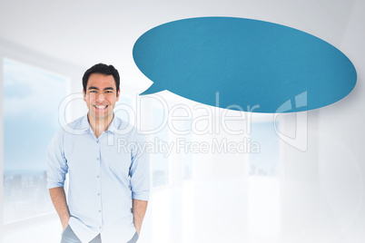 Composite image of smiling casual man standing with speech bubbl