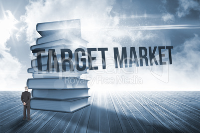 Target market against stack of books against sky