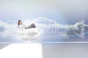 Composite image of relaxed businesswoman lying