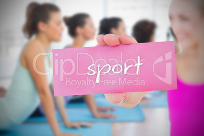 Fit blonde holding card saying sport