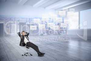 Composite image of businessman sitting on swivel chair