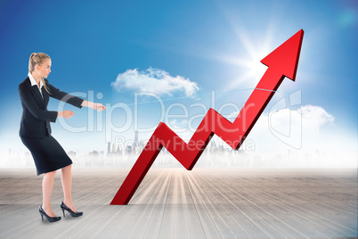 Composite image of businesswoman pulling a rope around arrow