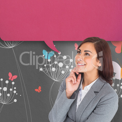 Composite image of smiling thoughtful businesswoman with speech