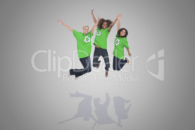 Composite image of enviromental activists jumping and smiling