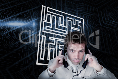 Composite image of maze and businessman tangled in wires
