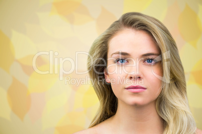 Composite image of serious blonde natural beauty