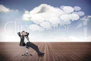 Composite image of businessman sitting on swivel chair