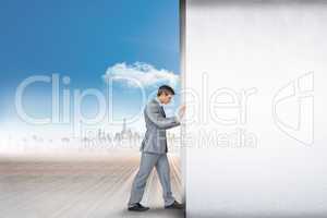 Composite image of businessman pushing away scene