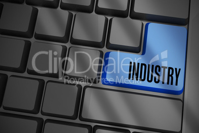 Industry on black keyboard with blue key