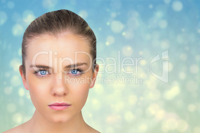 Composite image of serious blonde natural beauty