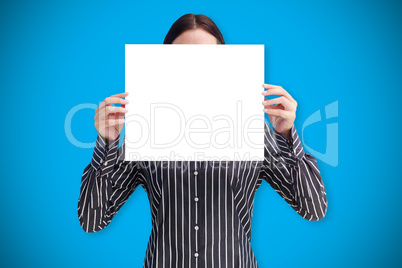 Composite image of businesswoman showing card