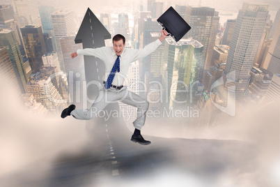 Composite image of cheerful jumping businessman with his suitcas