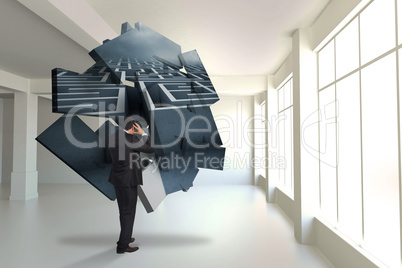 Composite image of stressed businessman with hands on head