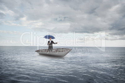 Composite image of peaceful businessman holding blue umbrella in