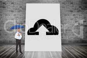 Composite image of happy businessman holding umbrella