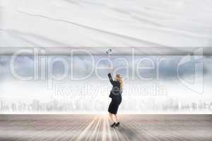 Composite image of businesswoman pulling a white screen