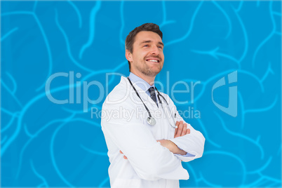 Composite image of handsome young doctor with arms crossed