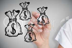 Composite image of businesswoman drawing money bags