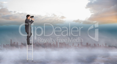 Composite image of businessman standing on ladder