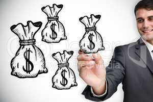 Composite image of businessman drawing money bags