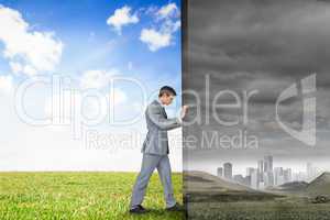 Composite image of businessman pushing away scene