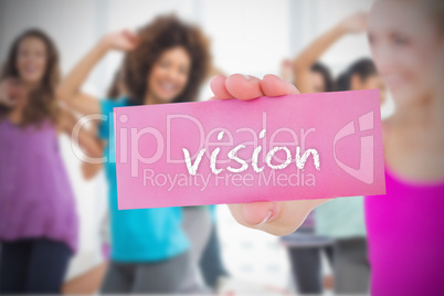 Fit blonde holding card saying vision