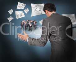 Composite image of businessman posing with hands out with tiny b
