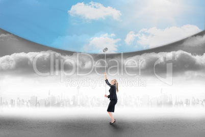 Composite image of businesswoman pulling down blue sky