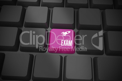 Exam on black keyboard with purple key