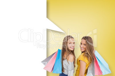 Composite image of two young women with shopping bags with speec