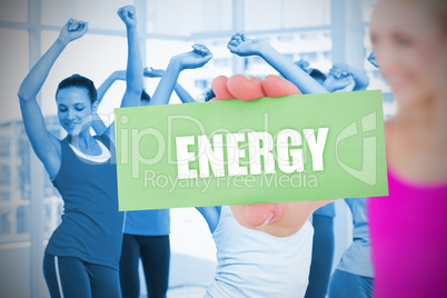 Fit blonde holding card saying energy
