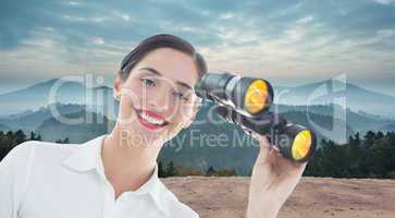 Composite image of smiling business woman with binoculars