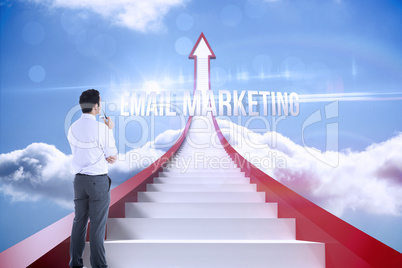 Email marketing against red steps arrow pointing up against sky