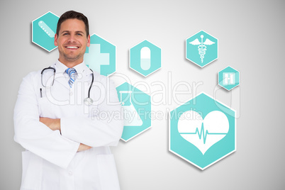 Composite image of handsome doctor with arms crossed Composite image of handsome doctor with arms crossed