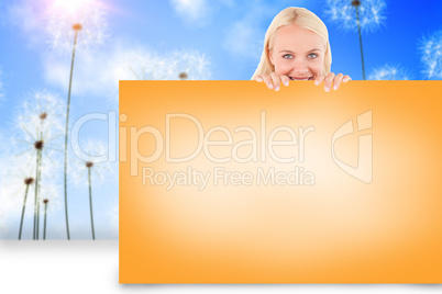 Composite image of pretty blonde showing card