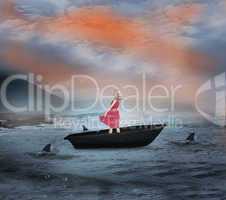 Composite image of smiling blonde turning in a sailboat