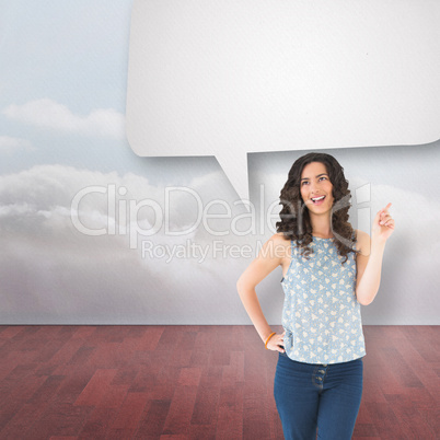 Composite image of happy beautiful brunette posing with speech b