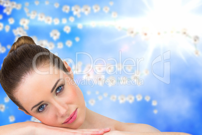 Composite image of beautiful brunette smiling at camera