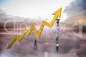 Composite image of business team holding up arrow