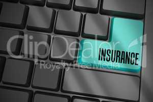 Insurance on black keyboard with blue key