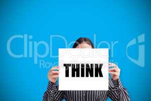 Businesswoman holding card saying think