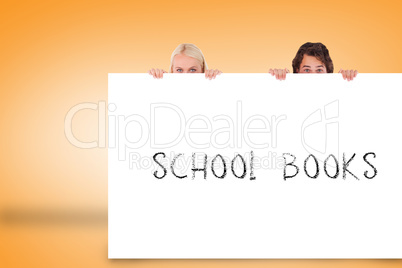 Attractive couple showing card with school books