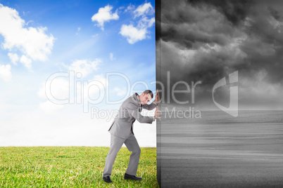 Composite image of businessman pushing away scene