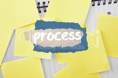 Process against sticky notes strewn over notepad