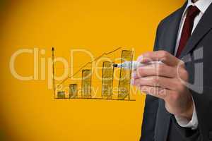 Composite image of businessman drawing graph