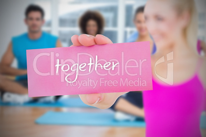 Fit blonde holding card saying together Fit blonde holding card saying together