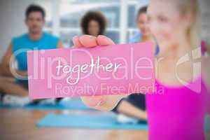 Fit blonde holding card saying together