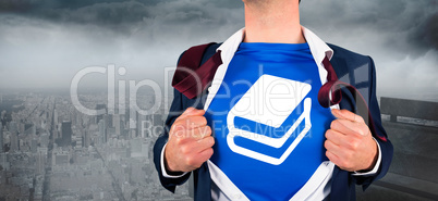 Composite image of businessman opening his shirt superhero style