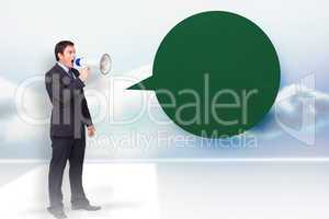 Composite image of standing businessman shouting through a megap